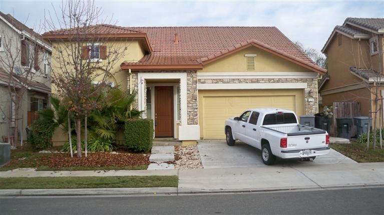 Two master bedrooms.  Three bedrooms downstairs including one full size master bedroom with private entrance to back yard.  One large bedroom upstairs with own full bathroom.  Kitchen has large island, plenty of pantry space and stainless appliances.