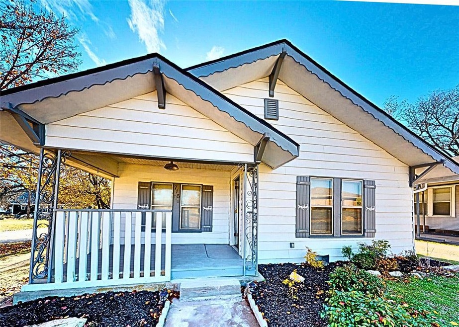 Bungalow featuring covered porch