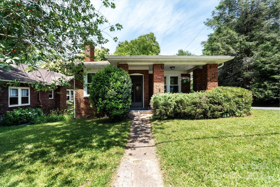 Welcome to your private corner lot in convenient west Asheville!