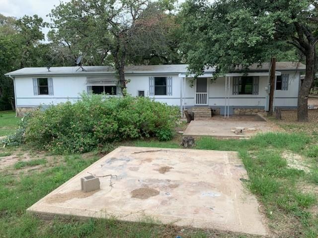 Back of property with a porch
