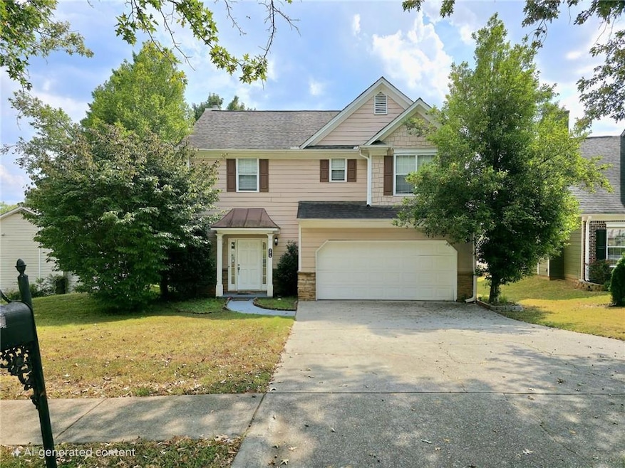 View of front of property with concrete driveway, a front lawn, and an attached garage