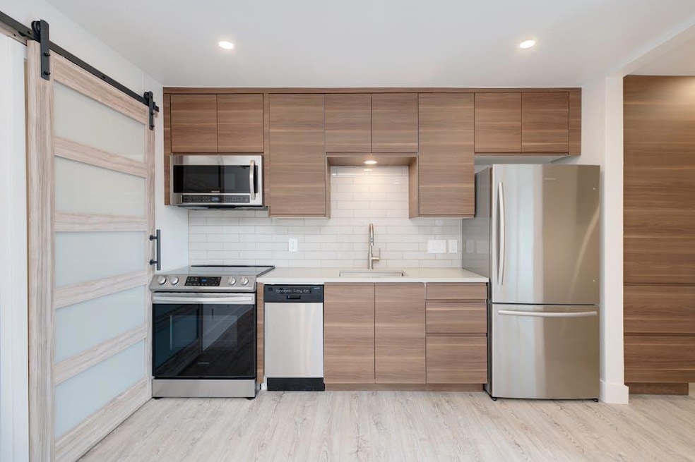 Kitchen with a sink, stainless steel appliances, 