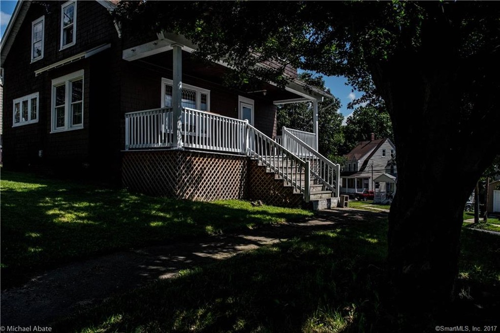 Front porch. Two trees provide shade and privacy, 