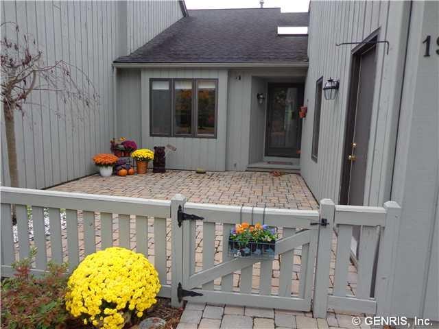 Exterior Front Welcome home! Lovely, custom stone 
