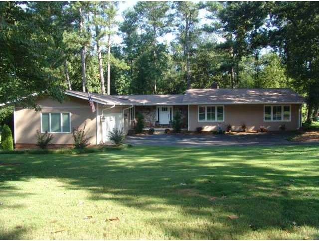Exterior Front. Located on the Green of #8 Choctaw