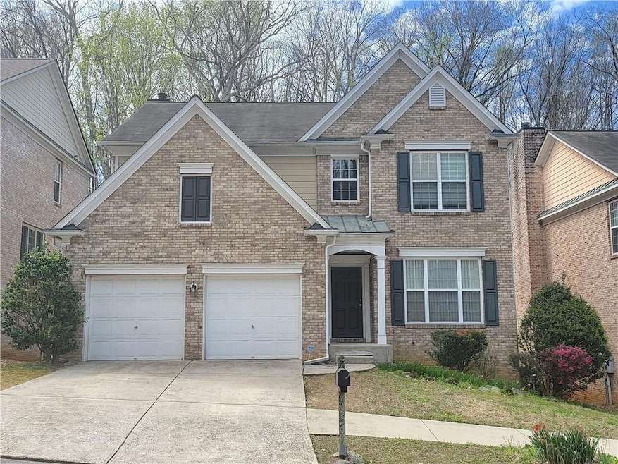 View of front of home featuring a garage