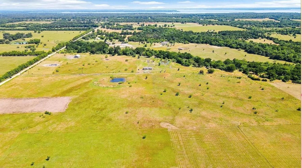 Birds eye view of property with a rural view