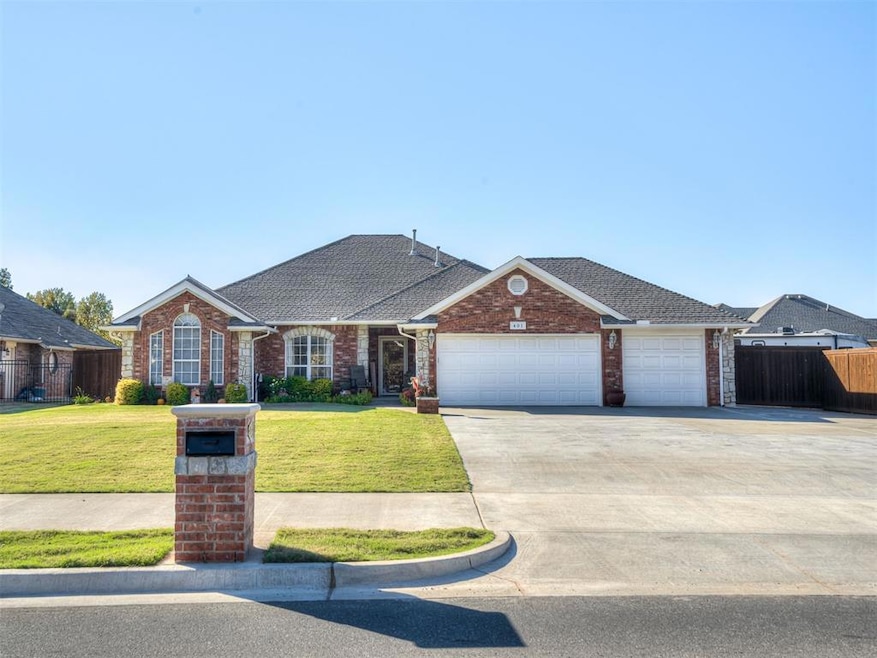 View of front of home with concrete driveway, brick siding, a garage, and roof with shingles