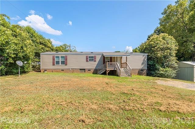 Front of home with covered porch/deck!