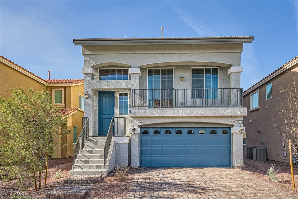 View of front of home featuring decorative drivewa