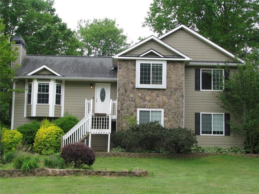 View of front of property with a front yard