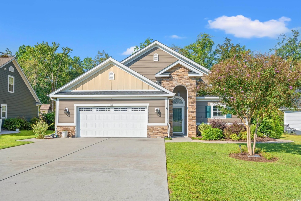 Craftsman-style house featuring a front yard and a