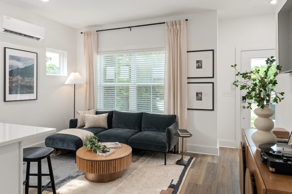 open concept kitchen and living. photos of similar model and not of actual home.