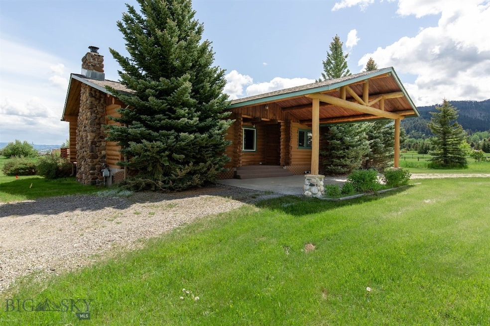 Log home with  almost 2 acres of land and views al