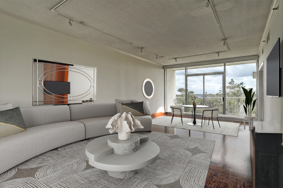 Living and dining areas with balcony overlooking d