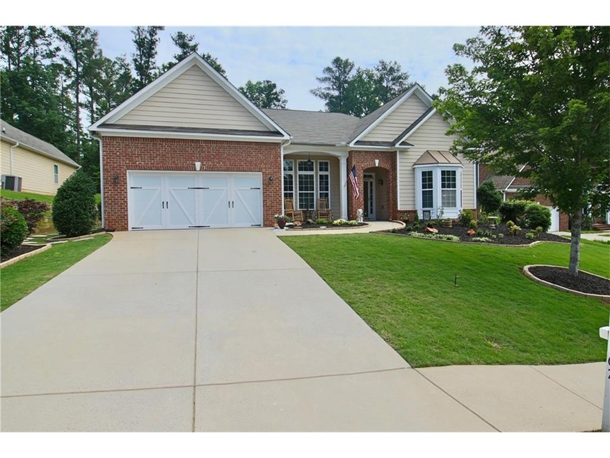 New Garage Door. Fresh Landscape, Large Lot.