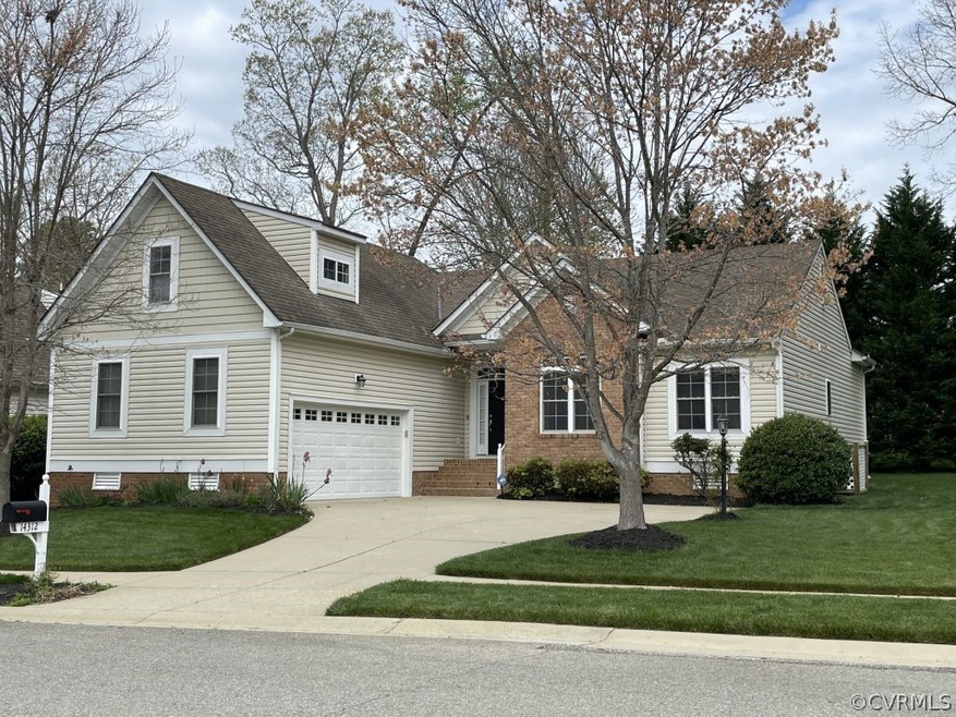 New england style home featuring a garage and a fr
