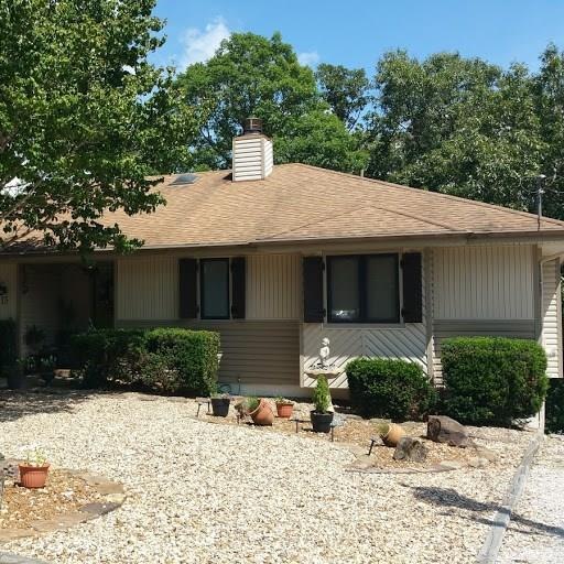 Easy care landscaping and new shutters enhance the outside.