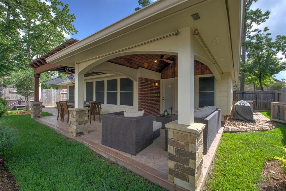 Lovely covered patio with stamped concrete and wood ceilings