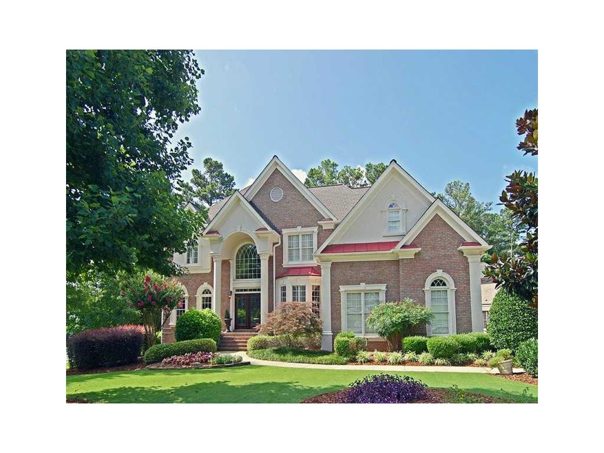 Exterior Front. Beautifully landscaped 4-sided BRI