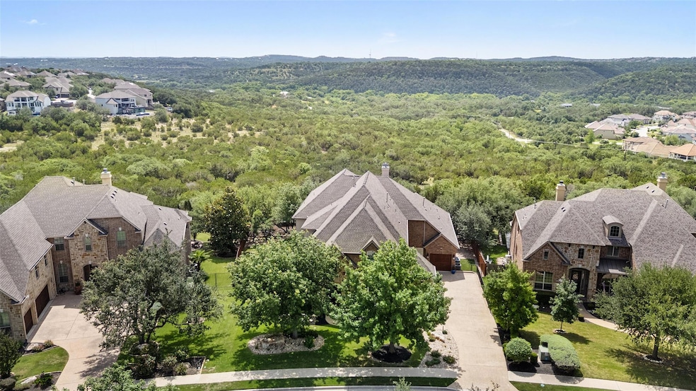 Aerial view of residential area featuring a forest