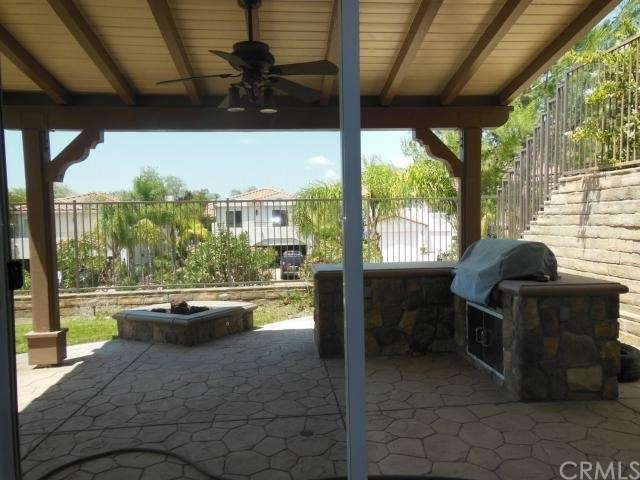 Covered Patio with stainless steel grill and fire 