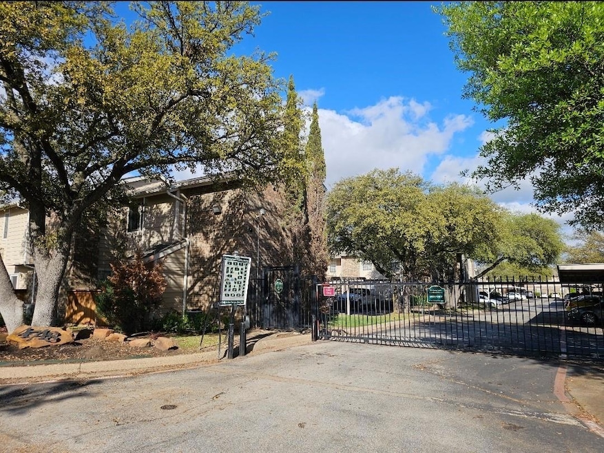 View of gate featuring fence