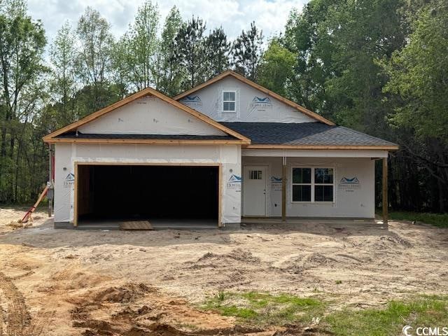 Property in mid-construction with an attached gara