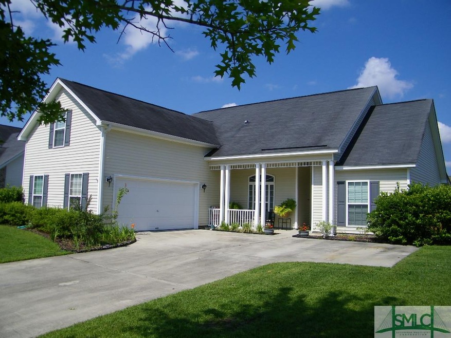 Exterior front with side entry garage.  Driveway c