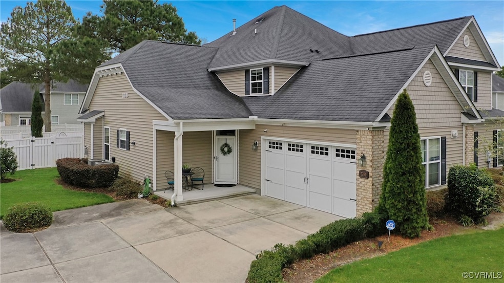 View of front of house with a front lawn, fence, a