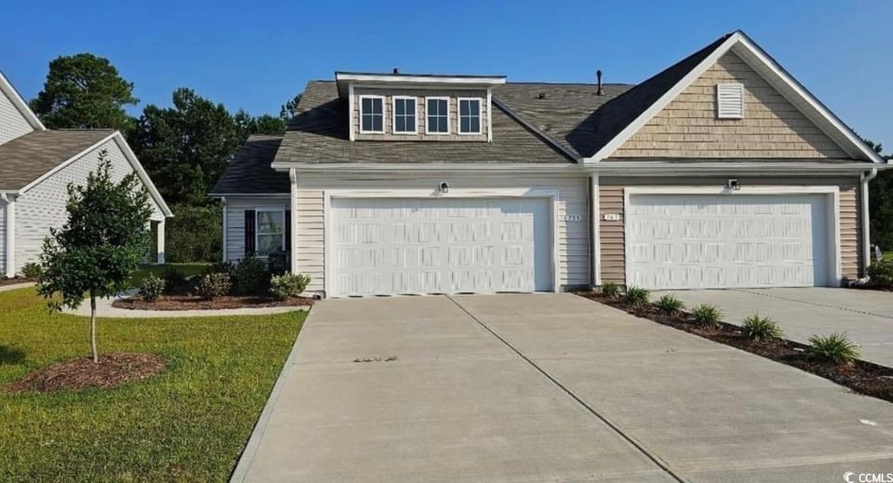 View of front of home featuring a garage and a fro