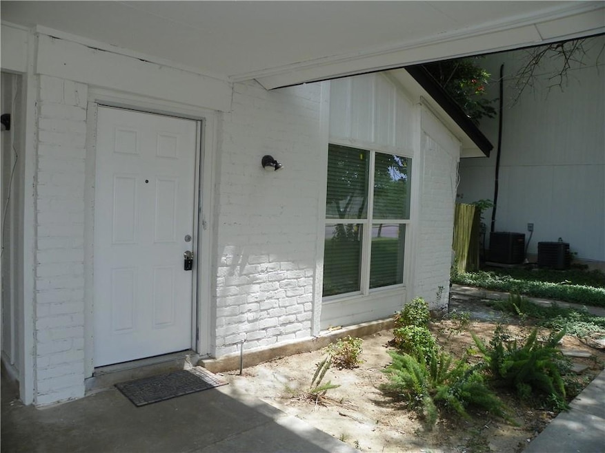 Property entrance with brick siding