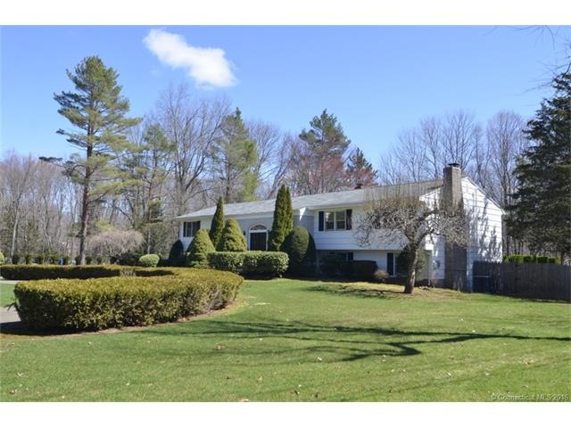 Brick front area, wood shingles, recently painted,