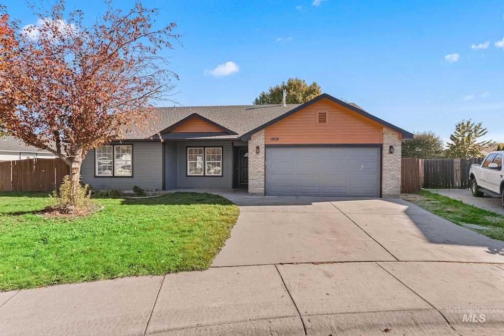Ranch-style home with driveway, brick siding, an attached garage, and roof with shingles