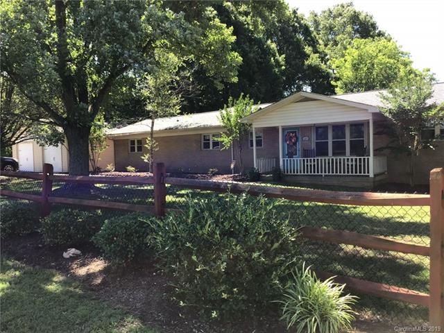 FRONT EXTERIOR WITH COVERED FRONT PORCH AND PARTIA