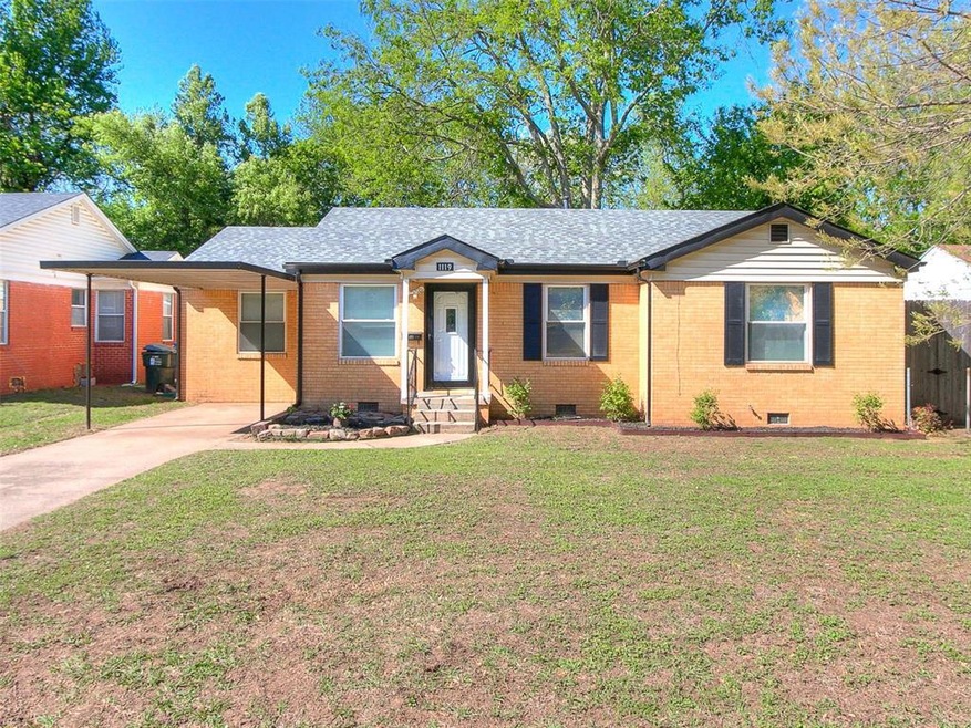 Ranch-style home with a front yard