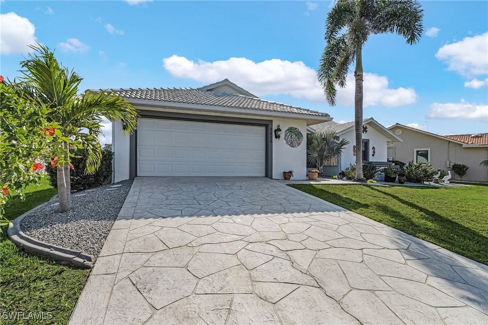 View of front of home featuring concrete driveway,