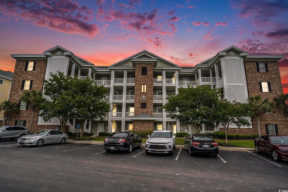 Property at dusk with uncovered parking
