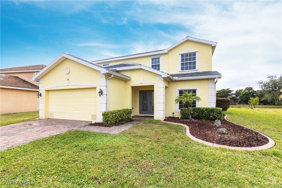 Traditional-style home with stucco siding, a front