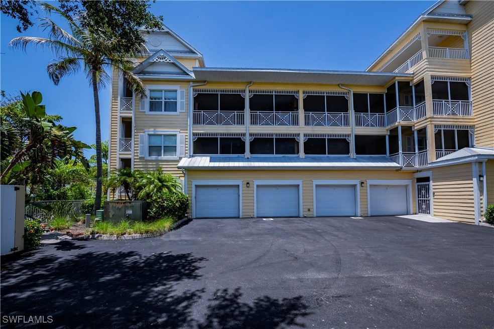 View of property with a garage