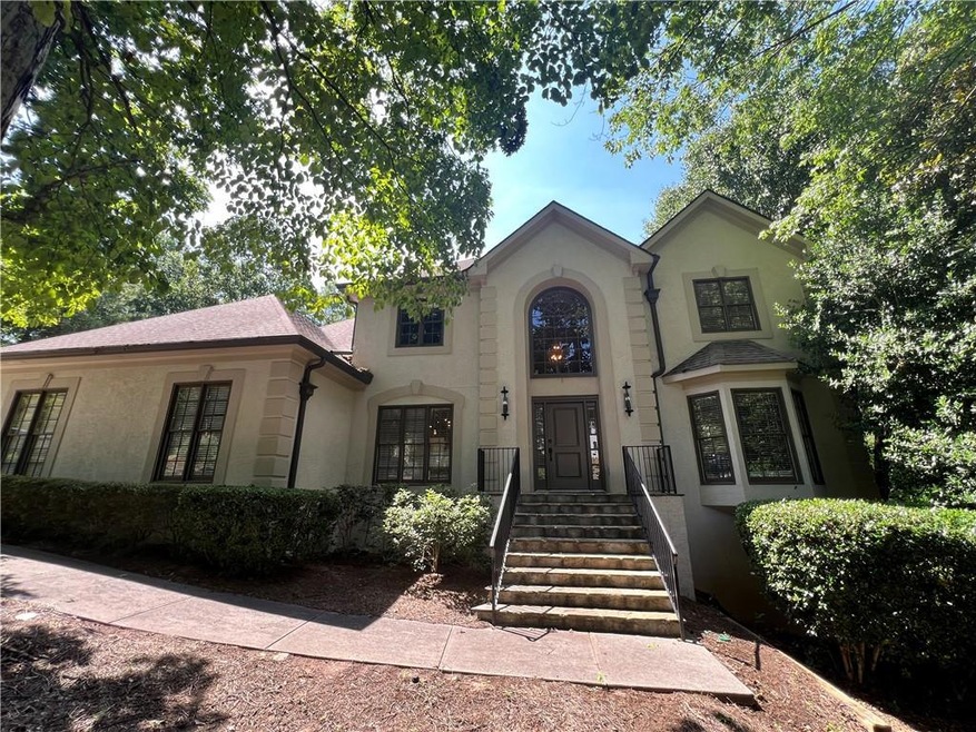 View of front of house featuring stucco siding