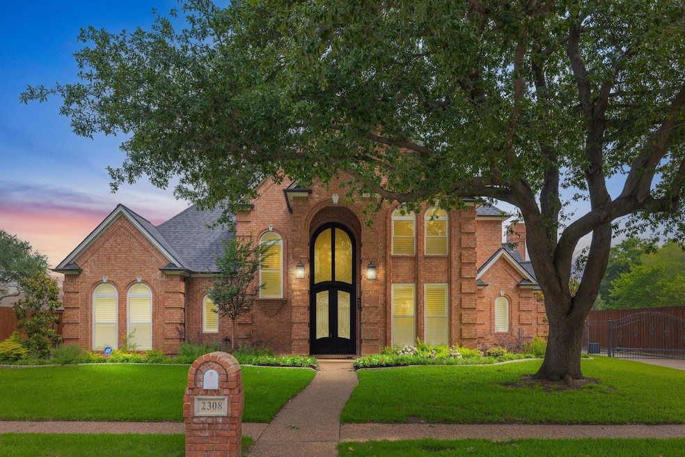 View of front of property with a yard