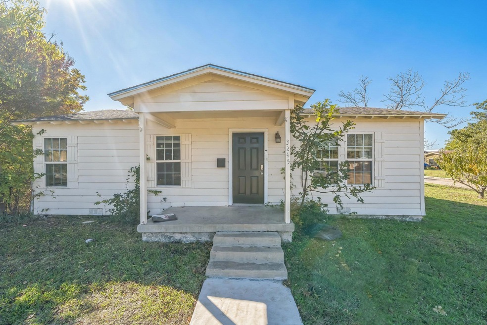 View of front of property with a front lawn and covered porch