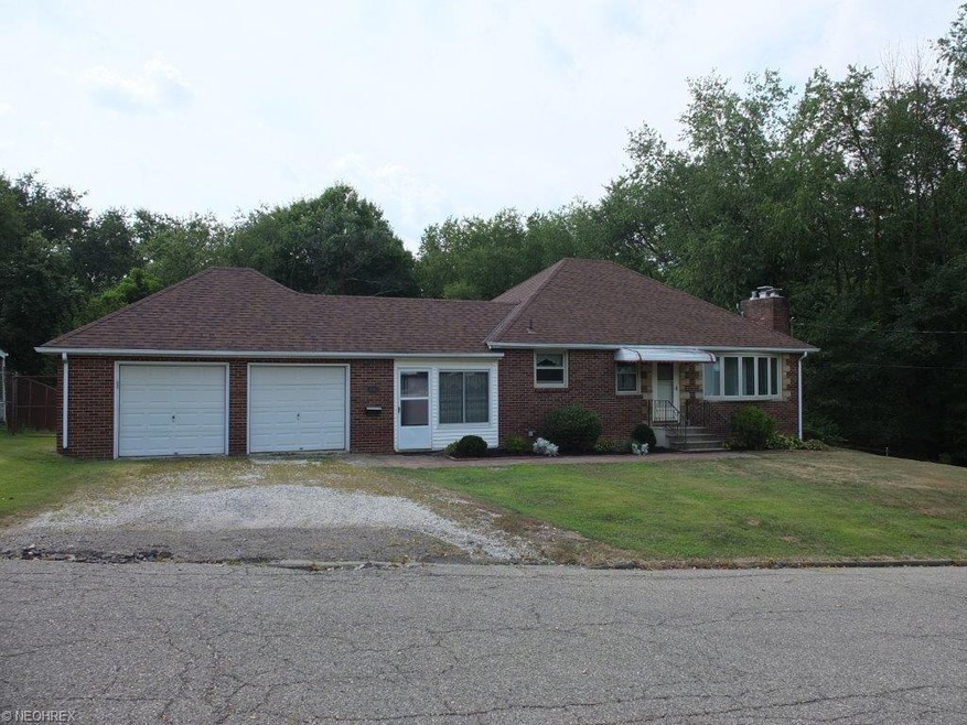 All brick 3 bedroom ranch with 2 car garage on fan