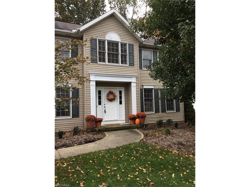 Beautiful vinyl sided colonial with covered porch,