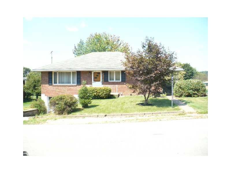 Exterior Front. Solid brick ranch in a quiet frien