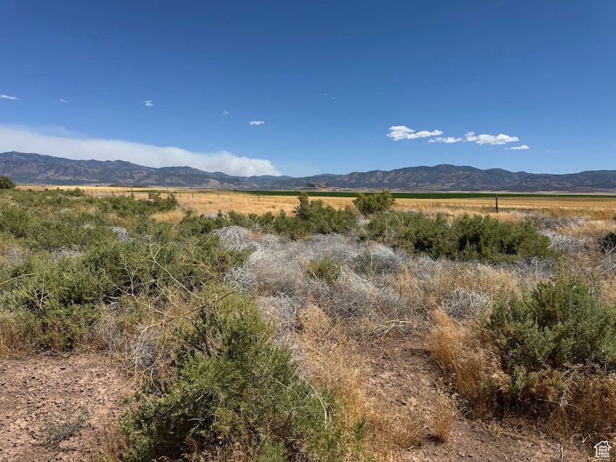 View of mountain background featuring rural landscape