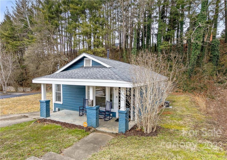 This charming, renovated Asheville bungalow feels like an urban oasis - in the middle of everything yet private and quiet! The unique location and zoning opens the potential to use property as an office, home office or ultra-convenient commute to wor