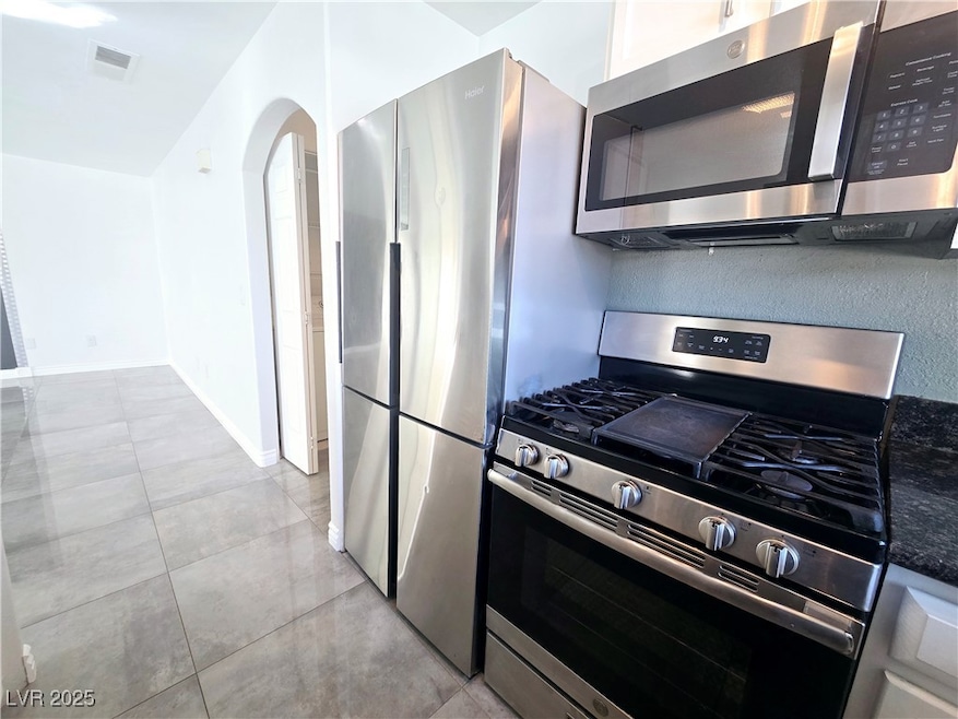 Kitchen with appliances with stainless steel finis