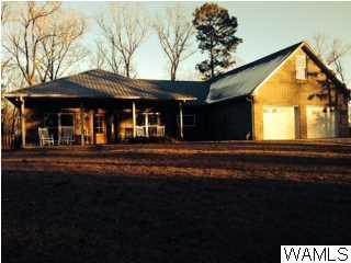 Lovely custom built home has stacked stone and bri